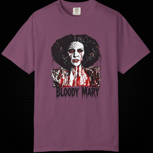 A mauve purple short-sleeve t-shirt featuring a graphic print of a horror character with the text 'BLOODY MARY' underneath, displayed against a solid black background.