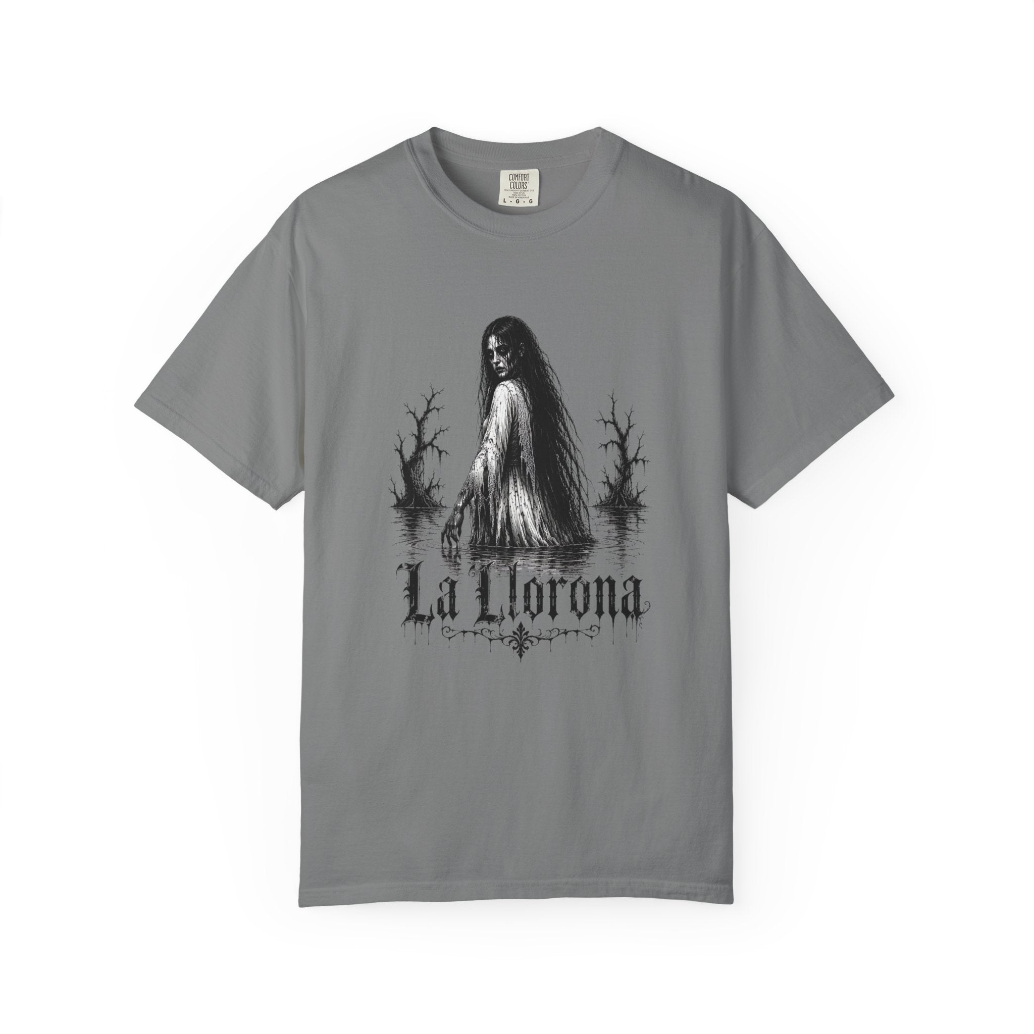 A gray short-sleeve crewneck t-shirt featuring a black and white graphic of a woman in a swamp with the text 'La Llorona' printed below, displayed on a clean white background.